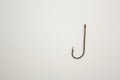 Fishing hook on a white paper background Royalty Free Stock Photo