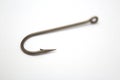 Fishing hook on a white paper background Royalty Free Stock Photo