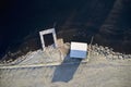 Fishing hut bothy and pier jetty at frozen ice lake in Scotland Royalty Free Stock Photo