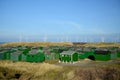 Fishing huts and Wind turbines