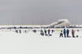 Fishermans on ice. Mans fishing on ice on gulf on Finland near Kronshtadt, Saint Petersburg, Russia, 03 February 2018