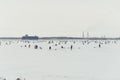 Fishermans on ice. Mans fishing on ice on gulf on Finland near Kronshtadt, Saint Petersburg, Russia, 03 February 2018