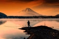 fishing at Lake against mt. fuji at dawn