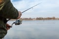 Fishing on the lake at sunset. Fisherman with rod, spinning reel on the river bank. Sunrise. Fishing for pike, perch, carp. Fog Royalty Free Stock Photo