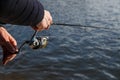 Fishing on the lake at sunset. Fisherman with rod, spinning reel on the river bank. Sunrise. Fishing for pike, perch, carp. Fog Royalty Free Stock Photo