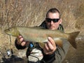 Fishing - lenok trout fishing in Mongolia Royalty Free Stock Photo