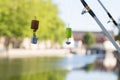Fishing Line and Floats Against Canal background Royalty Free Stock Photo