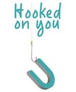 A fishing line and hook is hooked to the letter U