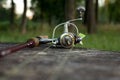 Fishing lure, rod and reel on wood Royalty Free Stock Photo