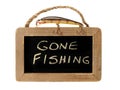 Fishing lure on top of gone fishing sign