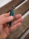 Fishing lures and accessories in the box background. Focus in the center of the bait Royalty Free Stock Photo