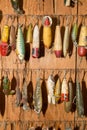 Fishing lures hanging against wall Royalty Free Stock Photo