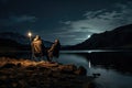 Fishing Man is Sitting at Night by Lake, Fishing Chair, Outdoor Tent, Fisherman Holds a Fishing Rod Royalty Free Stock Photo