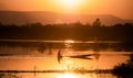 Fishing man with small fishing boat Royalty Free Stock Photo