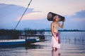 Fishing man use bamboo fish trap to catch fish in lake Royalty Free Stock Photo