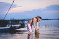 Fishing man use bamboo fish trap to catch fish in lake Royalty Free Stock Photo