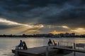 Fishing men by the lakeside