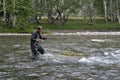 Fishing on the mountain river fishing rod. Fisherman fishing in the mountains. Trout fishing. Royalty Free Stock Photo