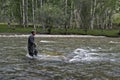 Fishing on the mountain river fishing rod. Fisherman fishing in the mountains. Trout fishing. Royalty Free Stock Photo