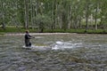 Fishing on the mountain river fishing rod. Fisherman fishing in the mountains. Trout fishing. Royalty Free Stock Photo