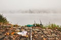 Fishing in the mysterious fog Royalty Free Stock Photo