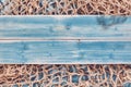 Fishing Net and Blue Painted Wood Planks Royalty Free Stock Photo