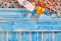 Fishing Net and Buoy on Blue Painted Wood Planks Royalty Free Stock Photo