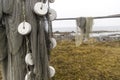 Fishing net is dried on wooden stanchions