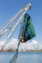 Fishing net hanging on board on fishing boat docked in the harbor