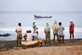 Fishing net with many fishermen on backside. Odayam beach, Varkala, India