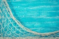 Fishing net on old blue board