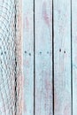 Fishing net on old rustic blue wooden boards Royalty Free Stock Photo