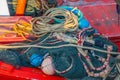 A fishing net with ropes and cord on the deck