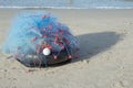 The fishing net is on the Rubber wheel and on the beach.