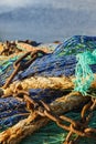 Fishing net with rusty chains with blue sea