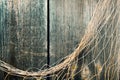 Fishing net on vintage wood, maritime nautical background texture