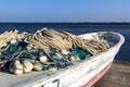 Fishing nets by boat before going out to sea