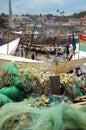 Fishing nets and boats on Cape Coast foreshore Royalty Free Stock Photo