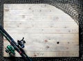 Fishing nets and fishing rod still-life on the wooden background