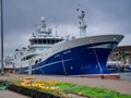 With fishing nets in the foreground, the Zephyr LK394 moored at Lerwick harbour, a midwater trawler built in 2019