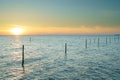 Fishing nets in lake at wonderful sunset