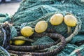 Fishing nets lying on the wharf at sunrise at the port of Norway Royalty Free Stock Photo