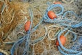 Fishing nets and sea ropes with buoys in the harbor. Royalty Free Stock Photo