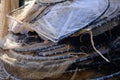 Fishing nets stored in bundles, stacked outdoors on the floor Royalty Free Stock Photo