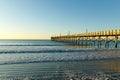 Fishing pier at the beach at sunrise, Sunset Beach, North Carolina Royalty Free Stock Photo