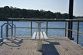 Fishing pier with empty bench Royalty Free Stock Photo
