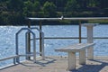 Fishing pier with empty bench Royalty Free Stock Photo