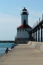 Fishing on the pier at the Michigan City lighthouse Royalty Free Stock Photo