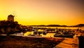 Fishing pier with ships in evening Royalty Free Stock Photo