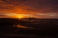 Fishing pier silhouette with sunris colored sky